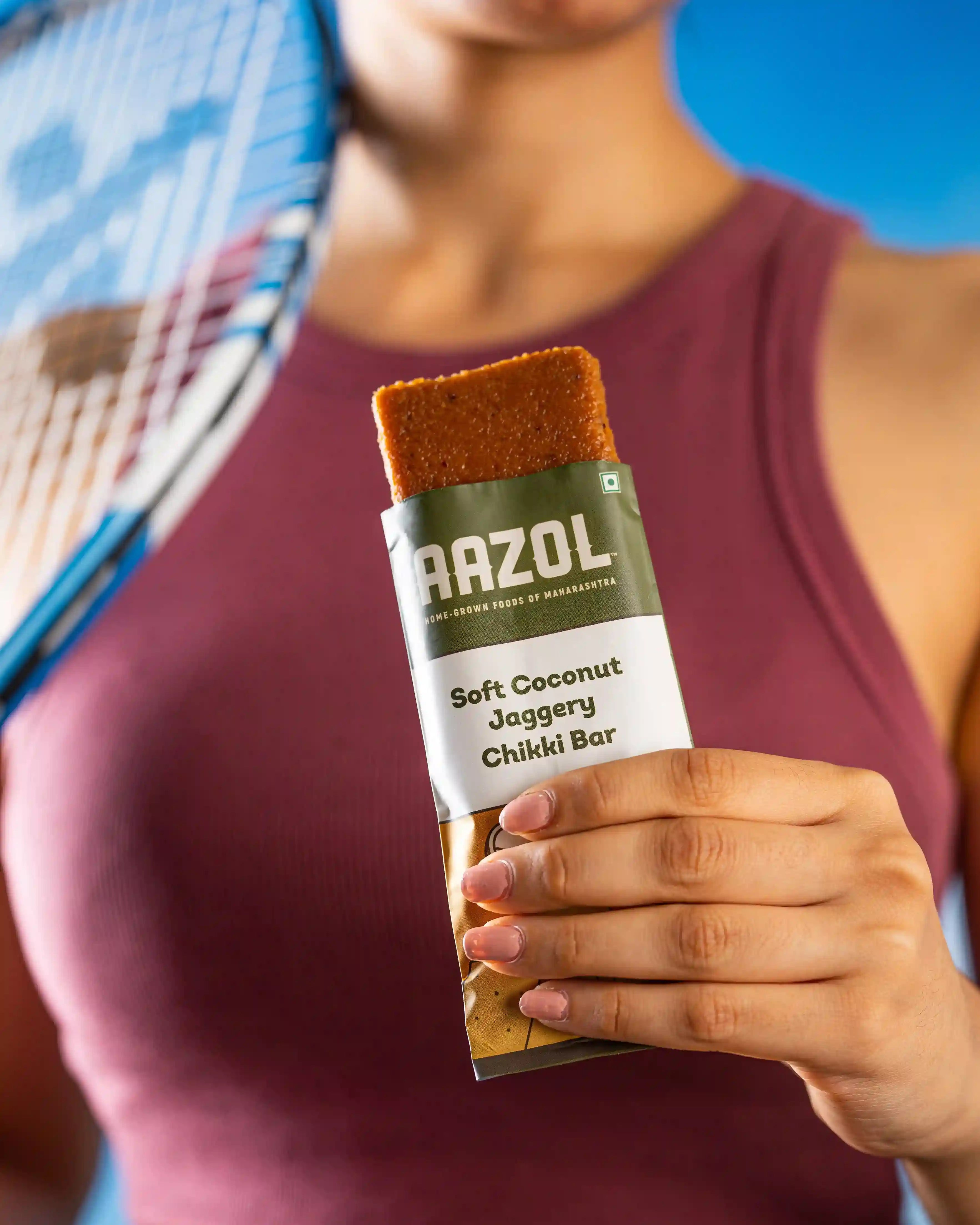 Sports player having Aazol's high-energy Soft Coconut Jaggery Chikki